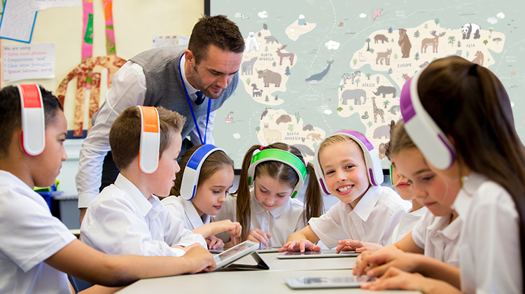 Teacher overseeing game by students with colorful headsets