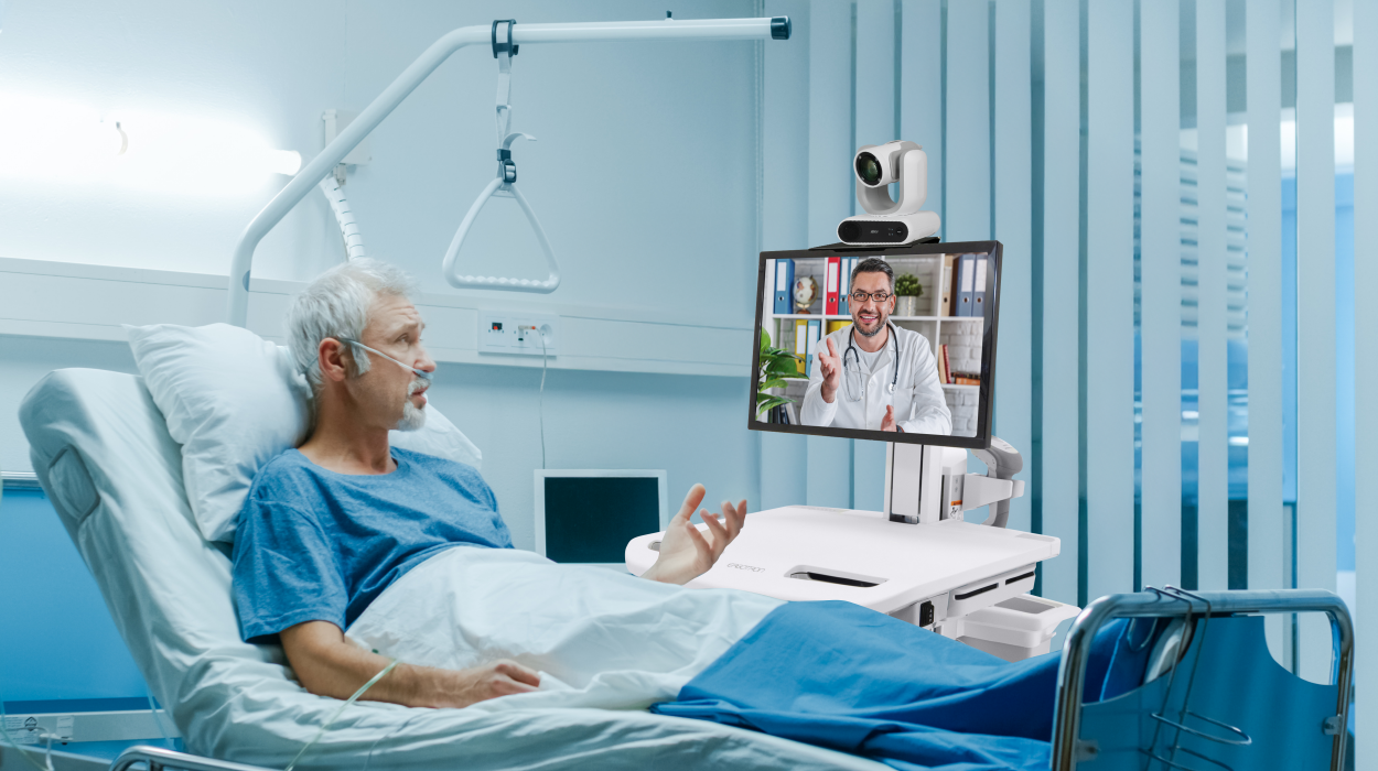 A doctor and patient using telehealth equipment to have a video conference